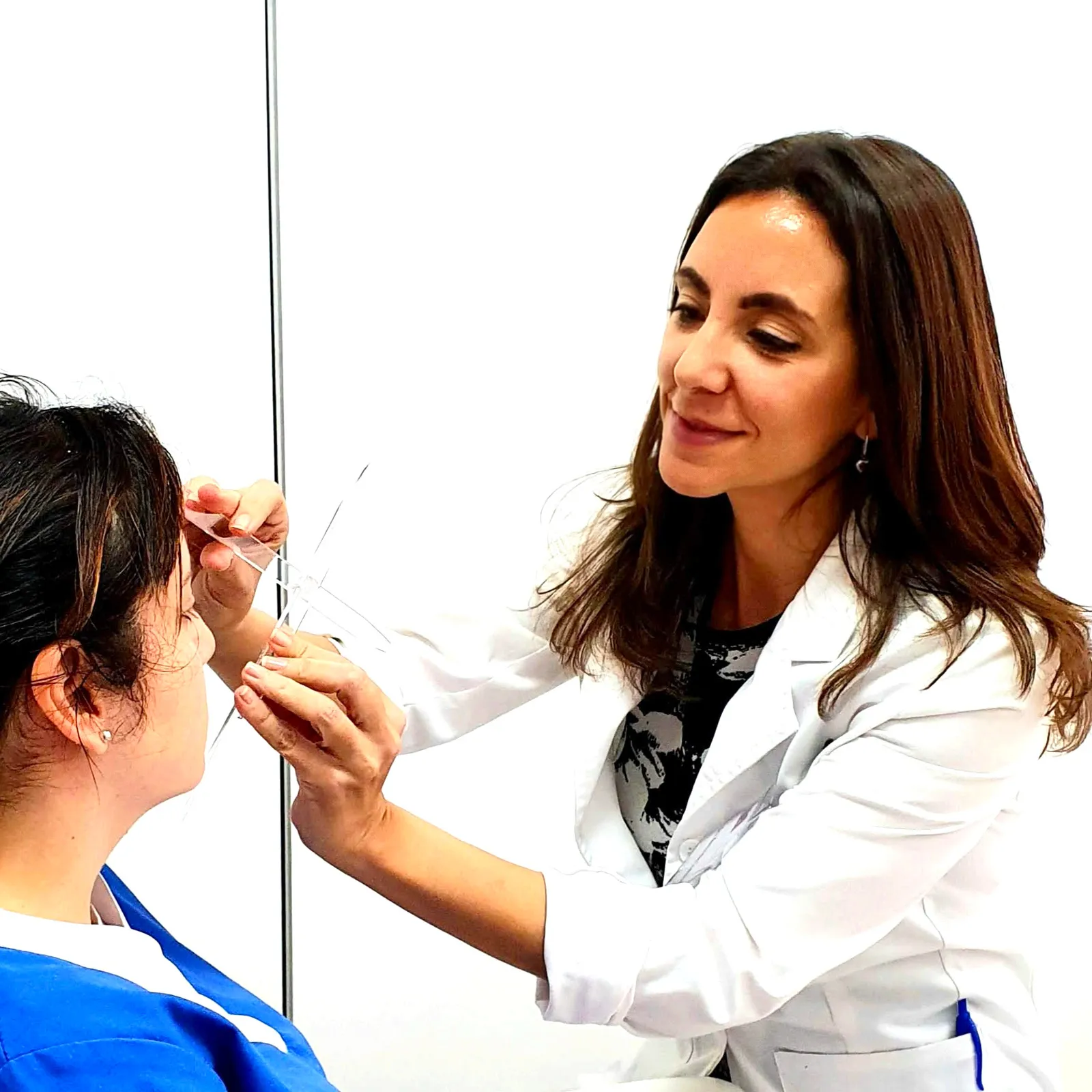 The doctor assessing a patient